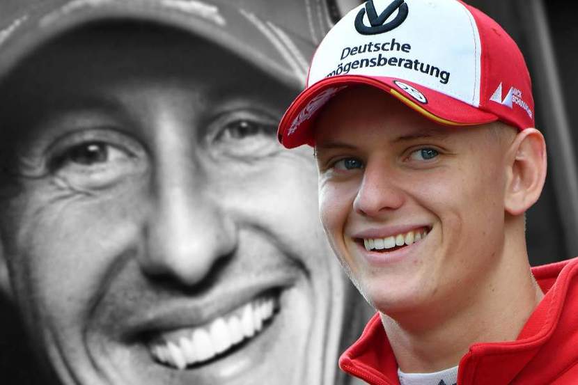 Mick Schumacher with his father's background image